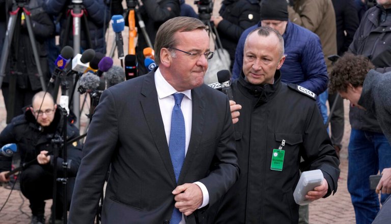German Defence Minister Boris Pistorius, front, leaves after a press conference during the meeting of the 