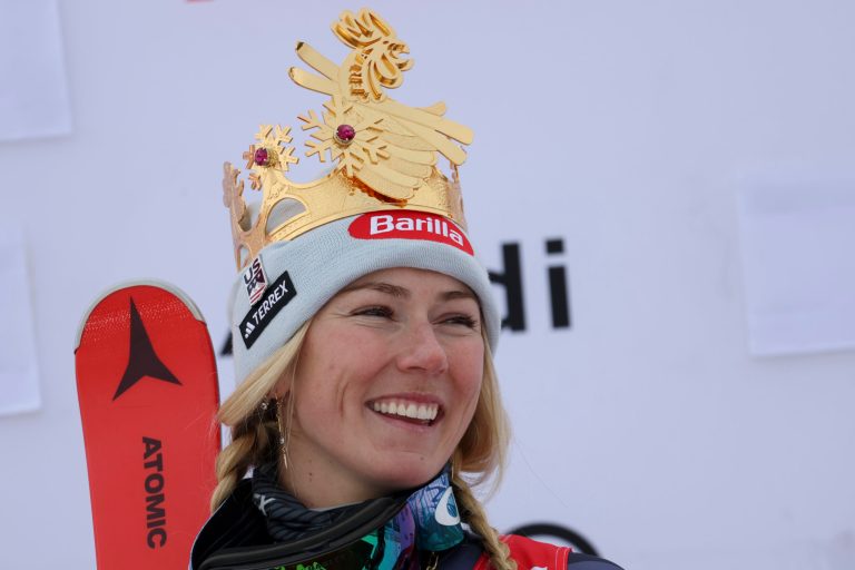 United States's Mikaela Shiffrin celebrates on the podium after winning an alpine ski, women's World Cup giant slalom, in Kronplatz, Italy, Tuesday, Jan. 24, 2023. Shiffrin won a record 83rd World Cup race Tuesday. 