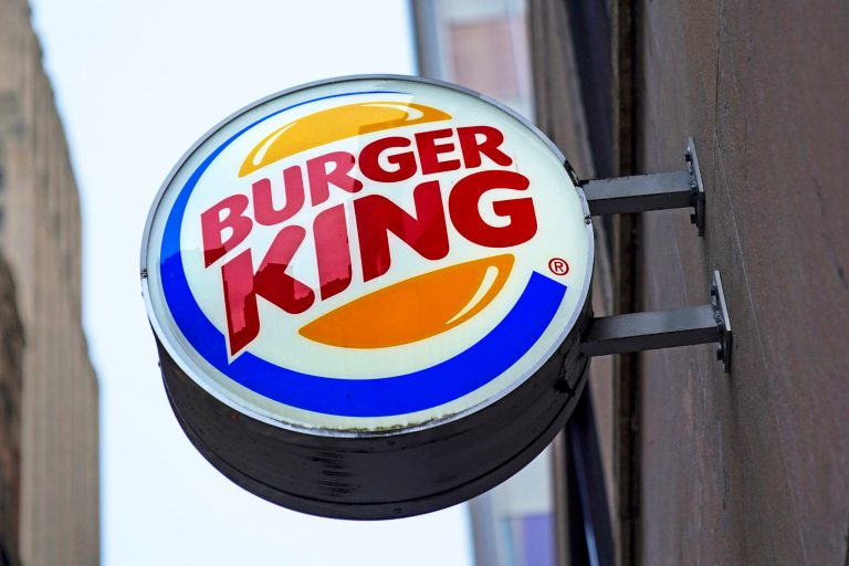 FILE - The Burger King logo is displayed on a sign outside a restaurant in downtown Pittsburgh on Wednesday, Jan. 12, 2022. (AP Photo/Gene J. Puskar, File)