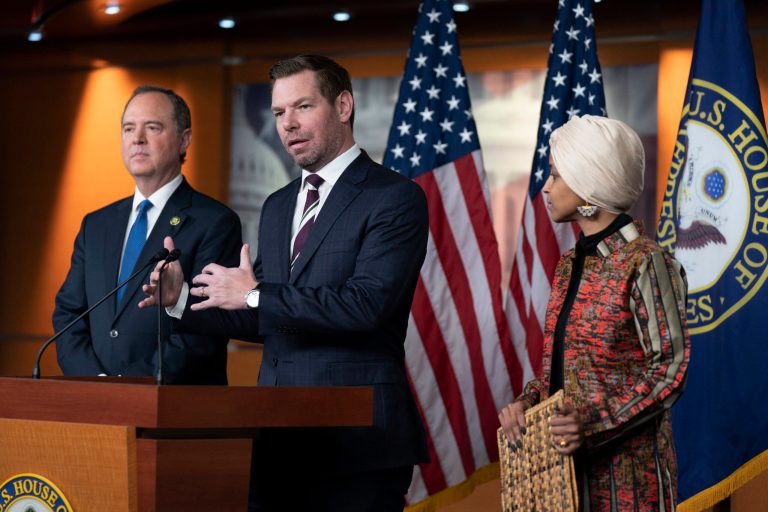 Rep. Eric Swalwell, D-Calif., center, with Rep. Adam Schiff, D-Calif., left, and Rep. Ilhan Omar, D-Minn., speaks during a news conference on Capitol Hill in Washington, Wednesday, Jan. 25, 2023, in Washington. (AP Photo/Manuel Balce Ceneta)