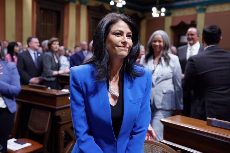 Michigan Attorney General Dana Nessel walks to her seat before the State of the State address, Wednesday, Jan. 25, 2023, at the state Capitol in Lansing, Michigan. 