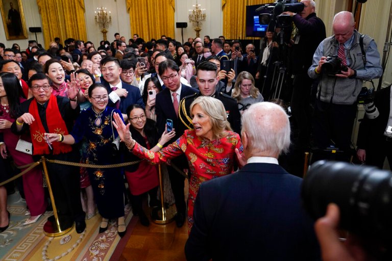 President Joe Biden and first lady Jill Biden depart a reception to celebrate the Lunar New Year in the East Room of the White House in Washington