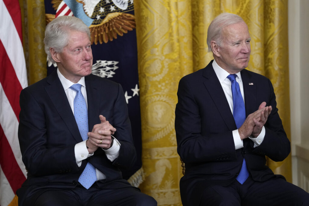 President Joe Biden and former President Bill Clinton listen as Vice President Kamala Harris speaks during an event in the East Room of the White House in Washington, Thursday, Feb. 2, 2023, to mark the 30thÂ Anniversary of the Family and Medical Leave Act.
