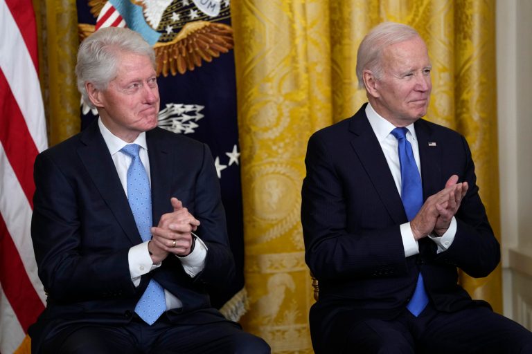 President Joe Biden and former President Bill Clinton listen as Vice President Kamala Harris speaks during an event in the East Room of the White House in Washington, Thursday, Feb. 2, 2023, to mark the 30thÂ Anniversary of the Family and Medical Leave Act.