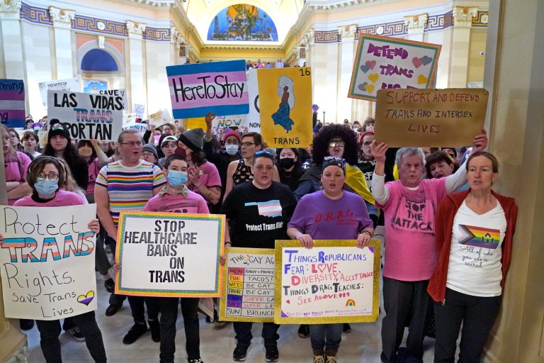 Trans-rights activists protest outside the House chamber at the state Capitol before the State of the State address on Feb. 6, 2023, in Oklahoma City.