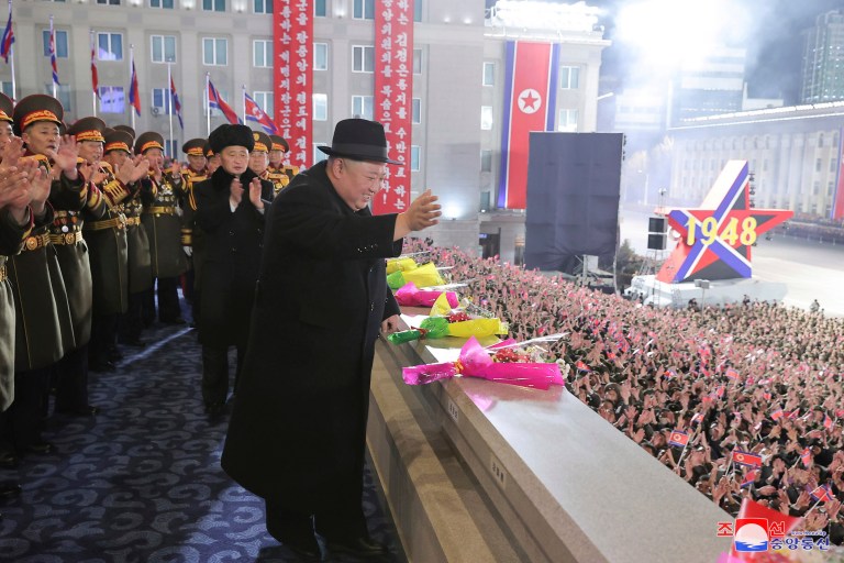 In this photo provided by the North Korean government, North Korean leader Kim Jong Un waves his hand toward people during a military parade at Kim Il Sung Square in Pyongyang, North Korea, Wednesday, Feb. 8, 2023. Independent journalists were not given access to cover the event depicted in this image distributed by the North Korean government. The content of this image is as provided and cannot be independently verified. Korean language watermark on image as provided by source reads: 