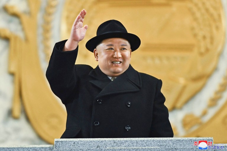 In this photo provided by the North Korean government, North Korean leader Kim Jong Un waves his hand as he looks at a military parade at Kim Il Sung Square in Pyongyang, North Korea, Wednesday, Feb. 8, 2023. Independent journalists were not given access to cover the event depicted in this image distributed by the North Korean government. The content of this image is as provided and cannot be independently verified. Korean language watermark on image as provided by source reads: 