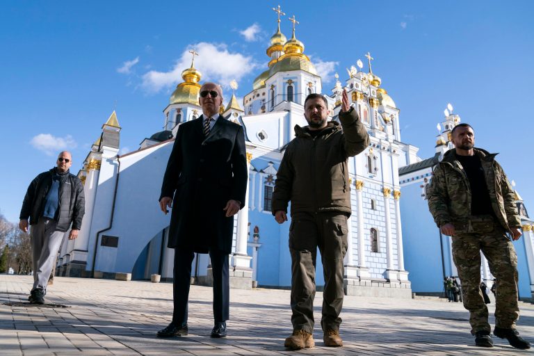 President Joe Biden, center left, walks with Ukrainian President Volodymyr Zelensky.