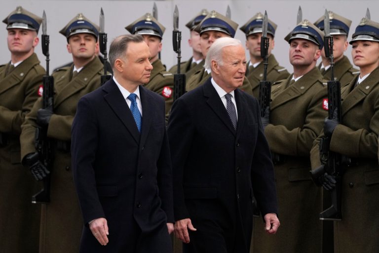 Polish President Andrzej Duda, left, welcomes President Joe Biden at the Presidential Palace in Warsaw, Ukraine, Tuesday, Feb. 21, 2023. 
