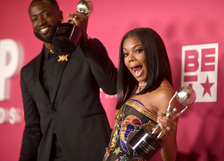 Dwyane Wade, left, and Gabrielle Union-Wade pose with the President's Award in the press room at the 54th NAACP Image Awards on Saturday, Feb. 25, 2023, at the Civic Auditorium in Pasadena, California.