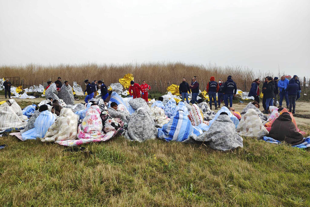 Migrant boat breaks apart off Italy, dozens dead, 80 survive