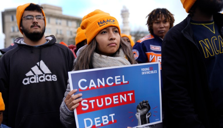 Student debt relief advocates gather outside the Supreme Court on Capitol Hill in Washington, Tuesday, Feb. 28, 2023, ahead of arguments over President Joe Biden's student debt relief plan. 