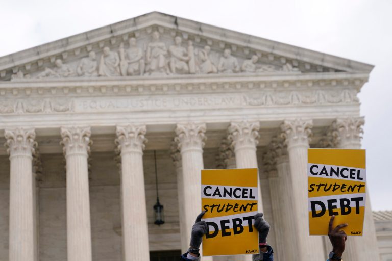 Student debt relief advocates gather outside the Supreme Court.