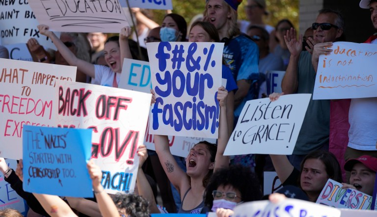 New College of Florida students and supporters protest ahead of a meeting by the college's board of trustees on Tuesday, Feb. 28, 2023, in Sarasota, Florida. The conservative-dominated board of trustees of Florida's public honors college was meeting Tuesday to take up a measure making wholesale changes in the school's diversity, equity, and inclusion programs and offices.