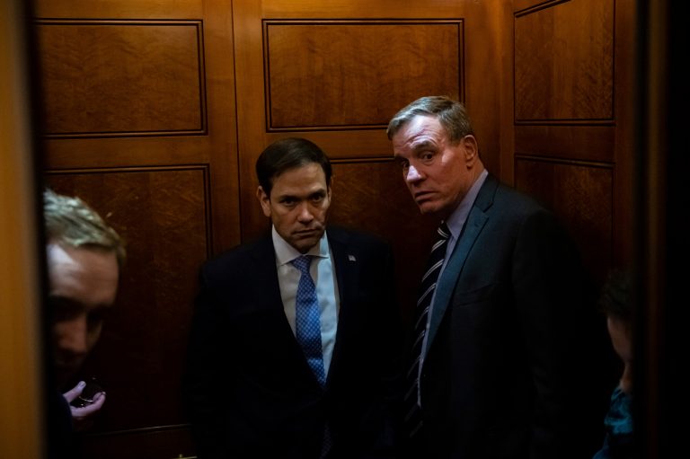 Sen. Marco Rubio (R-FL), left, and Sen. Mark Warner (D-VA), right, board an elevator at the U.S. Capitol, in Washington, D.C., on Tuesday, February 28, 2023.