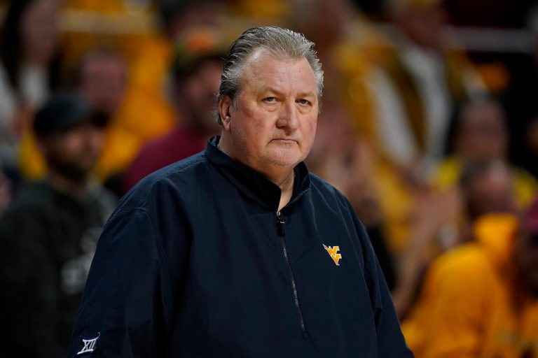 West Virginia head coach Bob Huggins watches from the bench during the first half of an NCAA college basketball game against Iowa State, Monday, Feb. 27, 2023, in Ames, Iowa. 