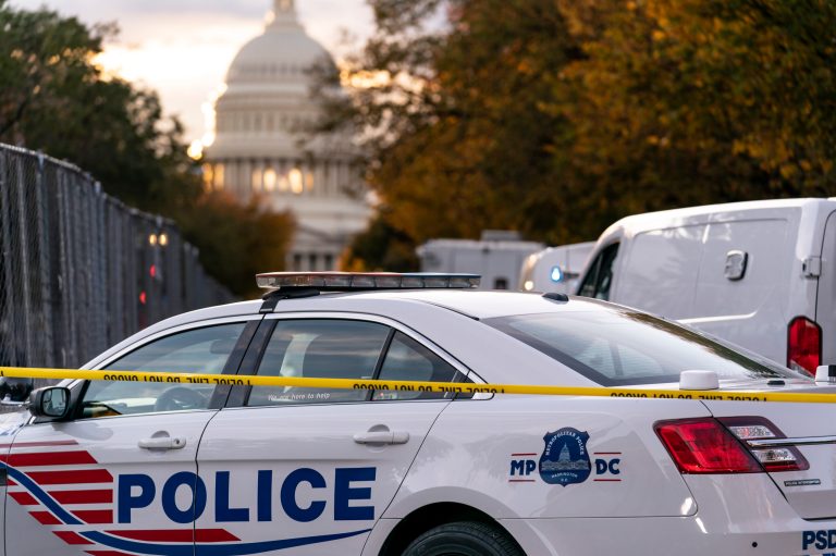 FILE - Washington Metropolitan Police investigate near the Supreme Court and Capitol after reports of a suspicious vehicle in which two men and a woman were detained with guns, in Washington, Oct. 19, 2022. 