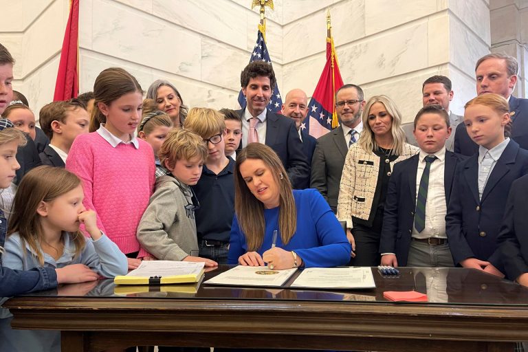 Republican Arkansas Gov. Sarah Huckabee Sanders signs into law an education overhaul bill on Wednesday, March 8, 2023 at the state Capitol in Little Rock, Ark. The legislation provides families with funds to pursue the learning environment thatâs right for them in addition to raising teacher salaries and restricting classroom instruction on gender identity and sexual orientation.  