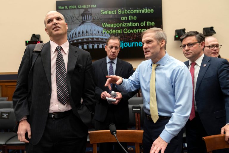 Chairman Jim Jordan, R-Ohio, and Rep. Mike Johnson, R-La., right, join witness Matt Taibbi, left, at the conclusion of a House Judiciary subcommittee hearing on what Republicans say is the politicization of the FBI and Justice Department and attacks on American civil liberties, on Capitol Hill in Washington, Thursday, March 9, 2023. 
