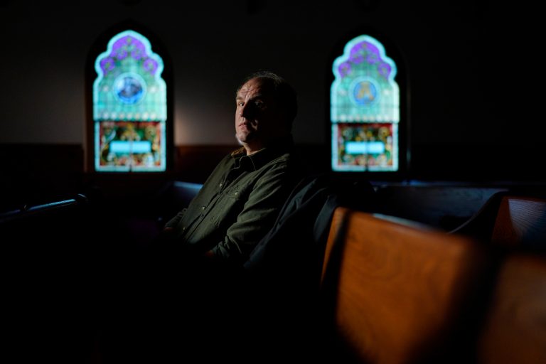 Gerald Groff, a former postal worker whose case will be argued before the Supreme Court, sits in a pew after a television interview with the Associated Press at a chapel at the Hilton DoubleTree Resort in Lancaster, Pa., Wednesday, March 8, 2023. 