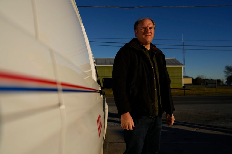 Gerald Groff, a former postal worker whose case will be argued before the Supreme Court, stands near a mail van outside the United States Post Office in Holtwood, Pa., Wednesday, March 8, 2023. 