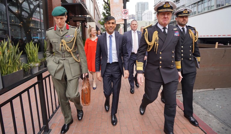 Britain's Prime Minister Rishi Sunak, center, and from left to right, Col Jaimie Norman, Admiral Sir Ben Key, First Sea Lord, and Commander Gus Carnie during Sunak's visit to San Diego on March 13, 2023, ahead of his meetings with US President Joe Biden and Prime Minister of Australia Anthony Albanese as part of Aukus, a trilateral security pact between Australia, the UK, and the US.