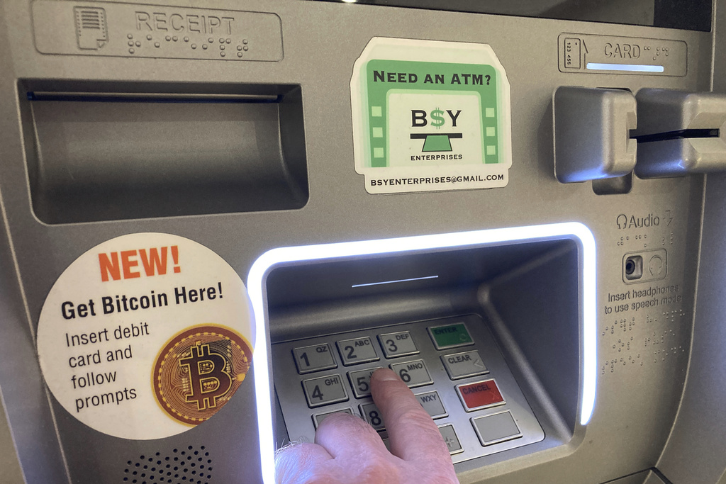 Gold prices hit record high and bitcoin surges to highest level in 20 months