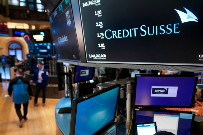A sign displays the name of Credit Suisse on the floor at the New York Stock Exchange in New York, Wednesday, March 15, 2023. 