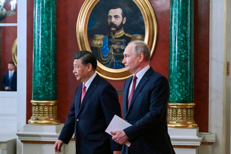 Russian President Vladimir Putin, right, and Chinese President Xi Jinping arrive to attend a signing ceremony following their talks at The Grand Kremlin Palace, in Moscow, Russia, Tuesday, March 21, 2023. 