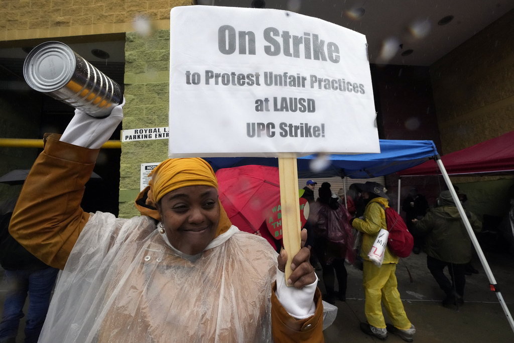 LA school strike: Teachers dance in the rain while parents scramble for child care