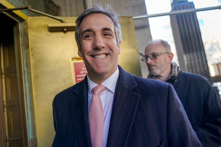 Donald Trump's former lawyer and fixer Michael Cohen smiles as he arrives for a second day of testimony before a grand jury on March 15, 2023, in New York. 