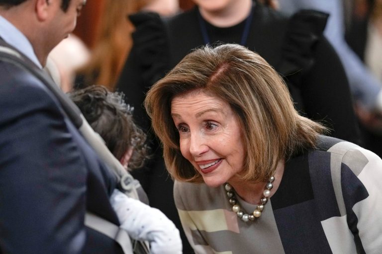 Rep. Nancy Pelosi, D-Calif., talks with Rep. Jimmy Gomez, D-Calif., and his son Hodge, as they arrive at an event in the East Room of the White House in Washington, Thursday, March 23, 2023, celebrating the 13th anniversary of the Affordable Care Act. 