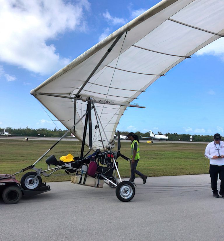 Key West International Airport personnel examine an ultralight aircraft that landed illegally at the airport carrying two Cuban men on Saturday, March 25, 2023, in Key West, Florida.