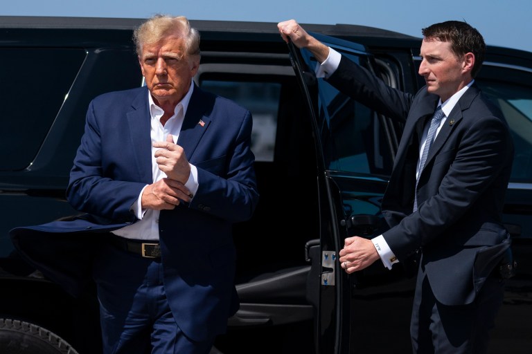 Former President Donald Trump arrives to board his airplane for a trip to a campaign rally in Waco, Texas, at West Palm Beach International Airport, March 25, 2023, in West Palm Beach, Fla.