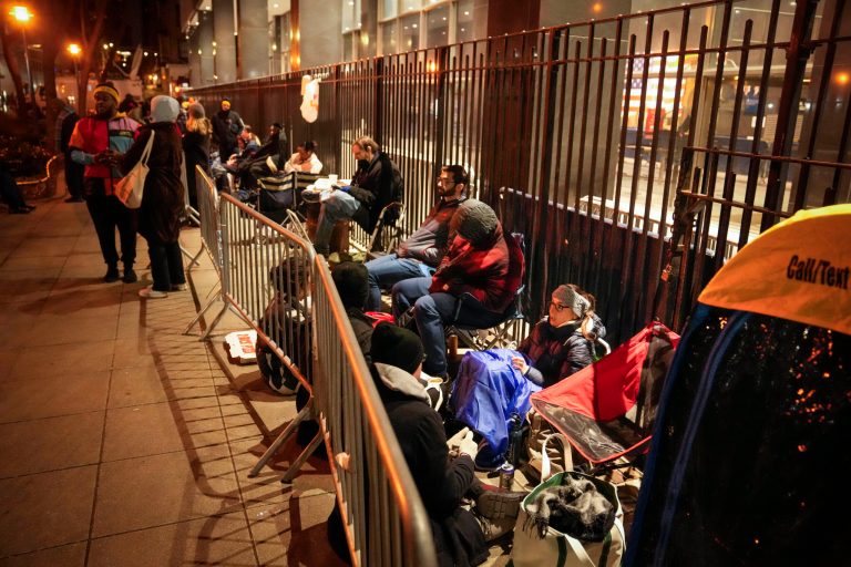 A line for court access is formed outside Manhattan Criminal Court on Tuesday, April 4, 2023, in New York. Former President Donald Trump is facing multiple charges of falsifying business records, including at least one felony offense, in the indictment handed up by a Manhattan grand jury. 
