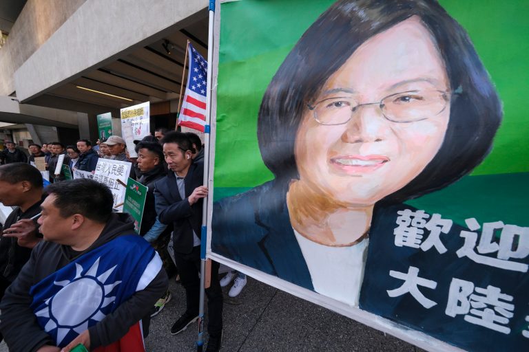 Supporters of Taiwan gather outside a hotel where Taiwanese President Tsai Ing-wen is expected to arrive in Los Angeles, Tuesday, April 4, 2023.