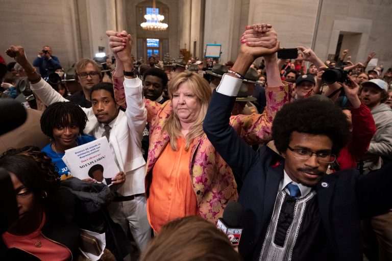 Former Rep. Justin Jones, D-Nashville, Rep. Gloria Johnson, D-Knoxville, and former Rep. Justin Pearson, D-Memphis, raises their hands outside the House chamber after Jones and Pearson were expelled from the legislature Thursday, April 6, 2023, in Nashville, Tennessee. 
