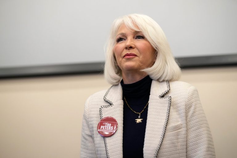 Tina Peters speaks during a debate on Feb. 25, 2023, in Hudson, Colo. A former Colorado county clerk accused of illegally accessing her election system has avoided jail time for a misdemeanor obstruction conviction in another case. A judge sentenced Peters on Monday, April 10, 2023, to 120 hours of community service and four months of home detention with an ankle monitor for trying to prevent authorities from taking an iPad she allegedly used to videotape a court hearing. 