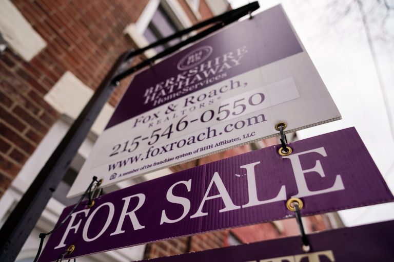 A for sale sign is posted near a home in Philadelphia, Wednesday, Jan. 4, 2023. (AP Photo/Matt Rourke)