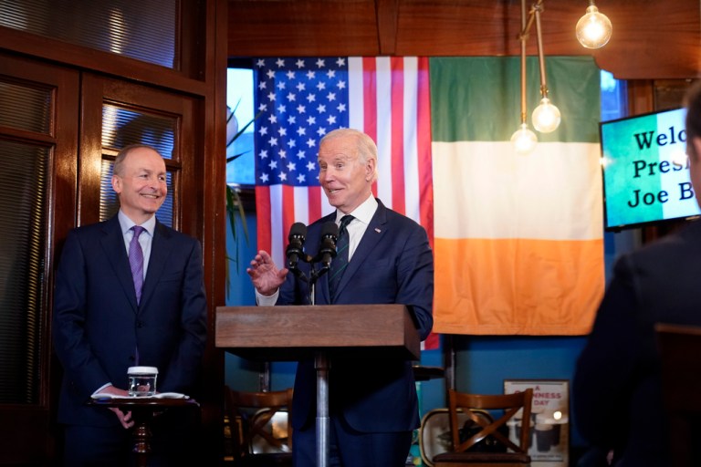 President Joe Biden speaks at the Windsor Bar and Restaurant in Dundalk, Ireland, Wednesday, April 12, 2023. MicheÃ¡l Martin, TÃ¡naiste of Ireland, listens at left.