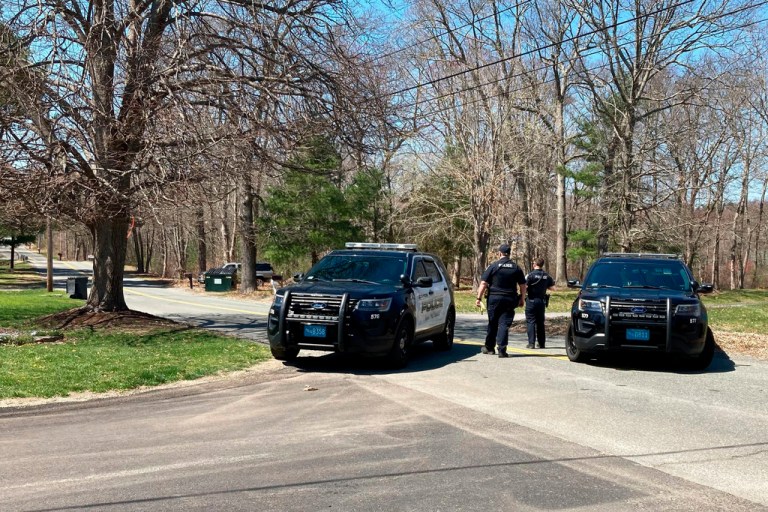 Police block a road in North Dighton, Mass., Thursday, April 13, 2023. The FBI arrested Jack Teixeira, a 21-year-old member of the Massachusetts Air National Guard in connection with the disclosure of highly classified military documents on the Ukraine war.