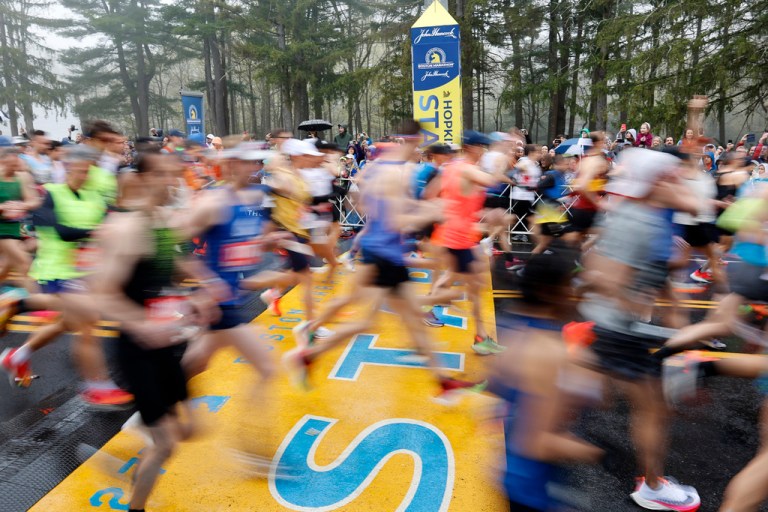 Runners cross the starting line during the 127th Boston Marathon, Monday, April 17, 2023, in Hopkinton, Mass. 