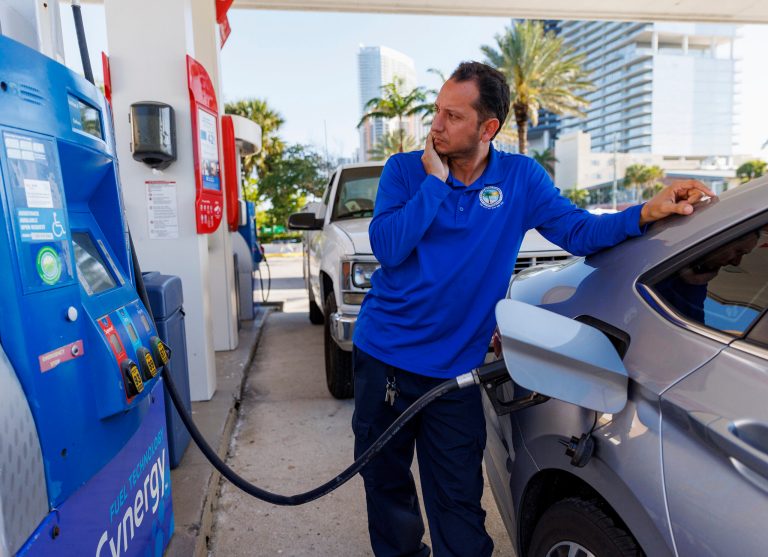A consumer puts fuel in his vehicle  in Sunny Isles Beach, Fla., on Tuesday, April 18, 2023. (David Santiago/Miami Herald via AP)