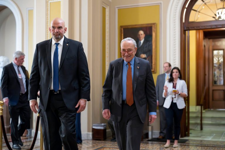 Sen. John Fetterman, D-Pa., left, walks with Senate Majority Leader Chuck Schumer, D-N.Y., as they head to a Democratic lunch at the Capitol in Washington, Tuesday, April 18, 2023.