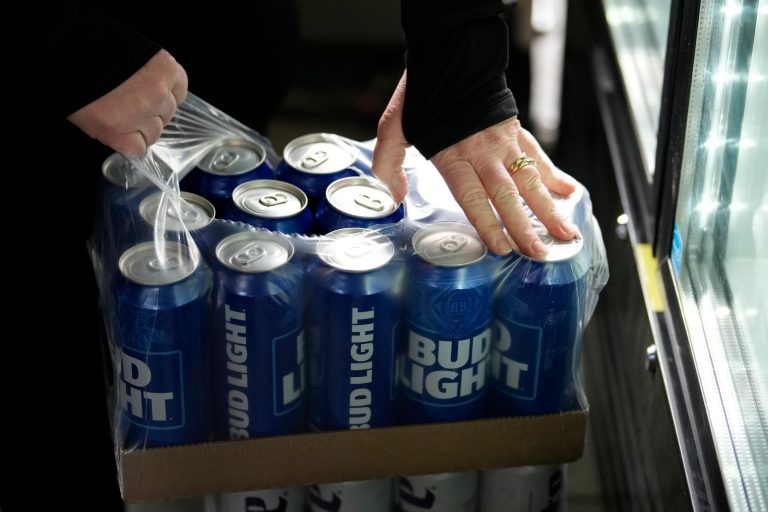 A stadium worker opens a case of Bud Light beer before a baseball game between the Philadelphia Phillies and the Seattle Mariners, Tuesday, April 25, 2023, in Philadelphia.