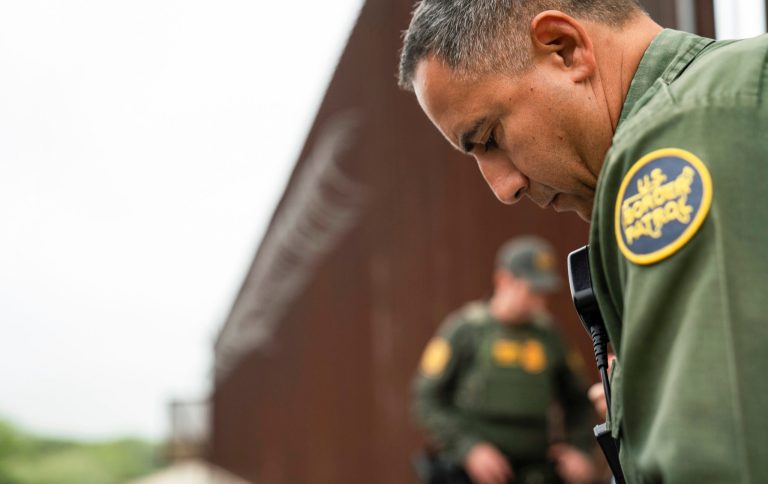 A U.S. Border Patrol agent begins the intake process for migrants from Colombia near the port of entry in Hidalgo, Texas, Thursday, May 4, 2023.