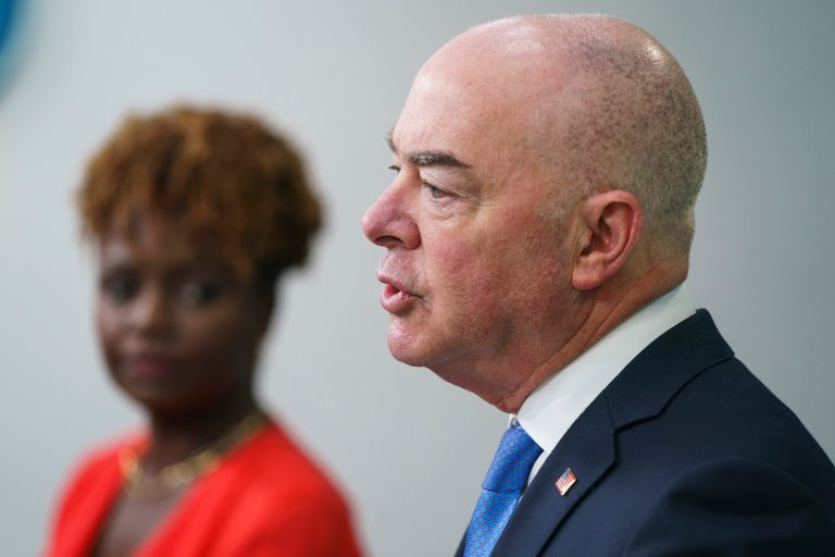 White House press secretary Karine Jean-Pierre listens as Homeland Security Secretary Alejandro Mayorkas speaks about border security during a briefing at the White House, Thursday, May 11, 2023, in Washington.