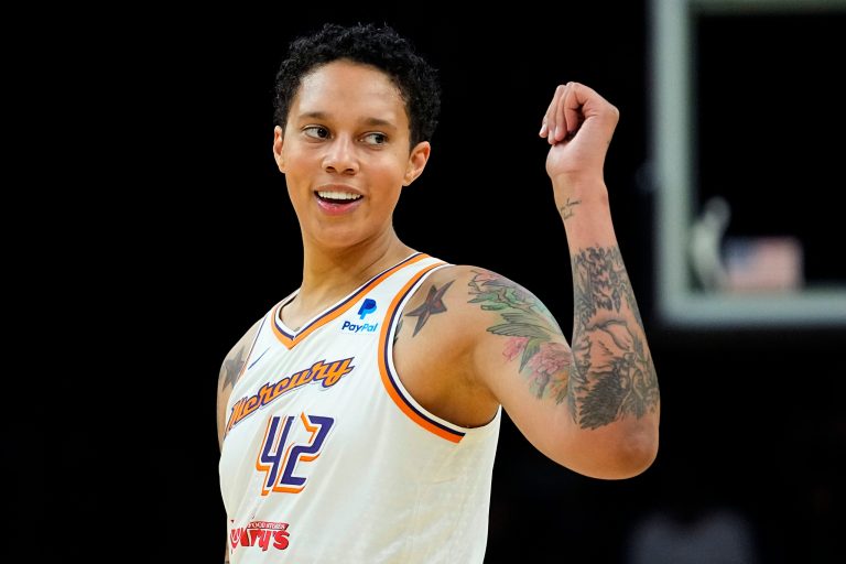 Phoenix Mercury center Brittney Griner smiles during the first half of a WNBA preseason basketball game.