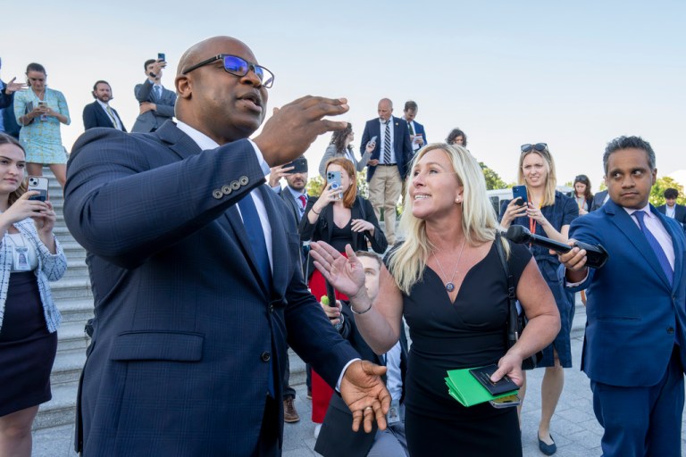 Rep. Jamaal Bowman, D-N.Y., left, and Rep. Marjorie Taylor Greene, R-Ga., argue on the steps of the Capitol after Bowman shouted down Rep. George Santos, R-N.Y., who was speaking to reporters following an effort to expel him from the House, in Washington, Wednesday, May 17, 2023. 