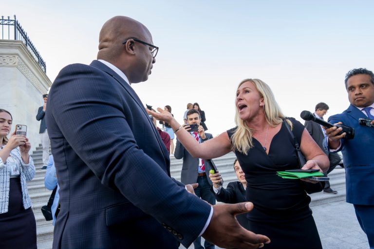 Rep. Jamaal Bowman, D-N.Y., left, and Rep. Marjorie Taylor Greene, R-Ga., argue on the steps of the Capitol after Bowman shouted down Rep. George Santos, R-N.Y., who was speaking to reporters following an effort to expel him from the House, in Washington, Wednesday, May 17, 2023. 